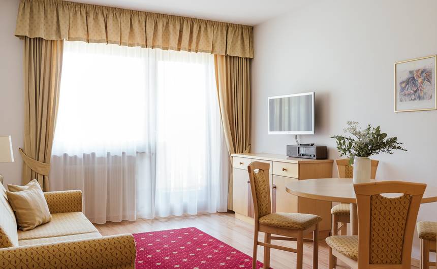 Modern double hotel room Juval with wooden furniture and mountain view at Hotel Bauhof in South Tyrol