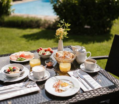 Breakfast in the garden at Hotel Bauhof with mountain view Breakfast in the garden at Hotel Bauhof with mountain view