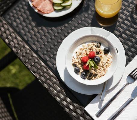 Healthy breakfast buffet with muesli, fruits, and yogurt at Hotel Bauhof Healthy breakfast buffet with muesli, fruits, and yogurt at Hotel Bauhof